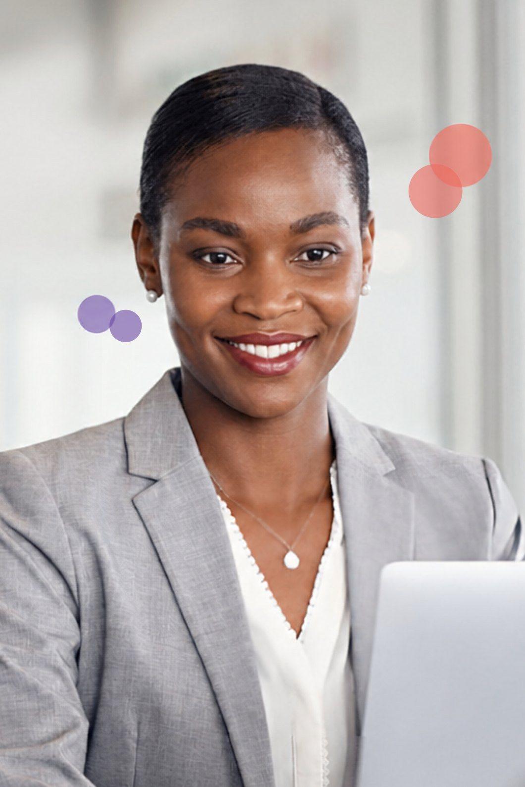 Professional woman smiling at her laptop